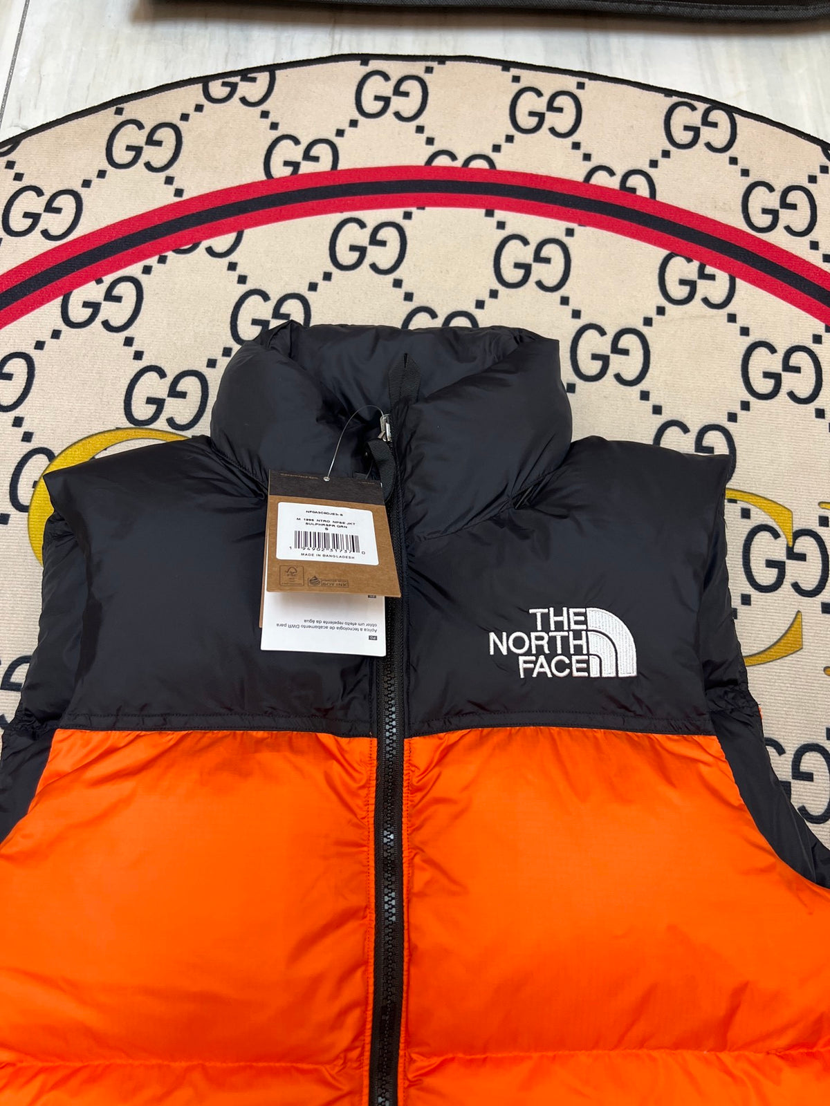 The North Face Orange and Black Color-Block Puffer Vest